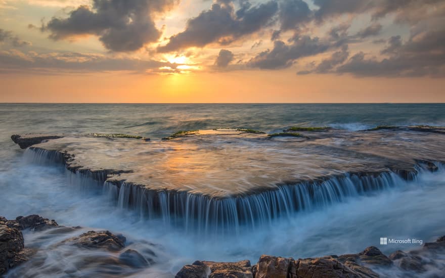 Seawater cascades over an ancient coral reef, Hang Rai, Vietnam