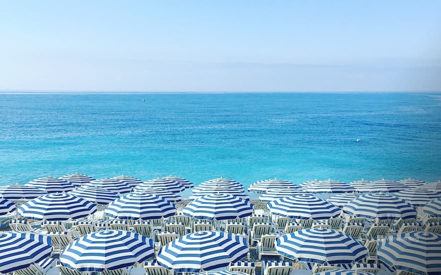 Umbrellas and deckchairs on a beach, Côte d´Azur, Nice